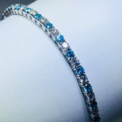 LIV platinum over sterling silver blue & white sapphire tennis bracelet