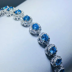 LIV Platinum over sterling silver blue & white sapphire halo tennis bracelet bracelet