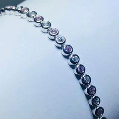 LIV platinum over sterling silver pink & white sapphire bezel halo tennis bracelet