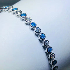 LIV platinum over sterling silver blue & white sapphire tennis bracelet
