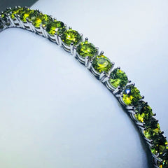 LIV platinum over sterling silver green sapphire prong set tennis bracelet