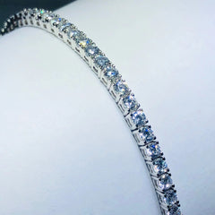 LIV platinum over sterling silver white sapphire prong set tennis bracelet