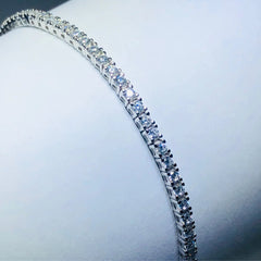 LIV platinum over sterling silver white sapphire prong set tennis bracelet
