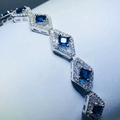 LIV platinum over sterling silver blue & white sapphire halo tennis bracelet