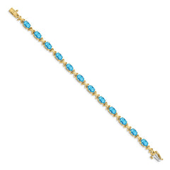 14k Complete 7x5mm Oval Swiss Blue Topaz X-design 7 inch Bracelet