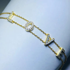 LIV 18k yellow gold over sterling silver white sapphire “love” bracelet bracelet