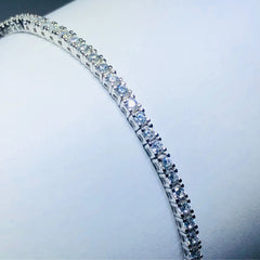 LIV platinum over sterling silver white sapphire prong set tennis bracelet