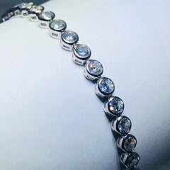 LIV Platinum over sterling silver white sapphire bezel tennis bracelet