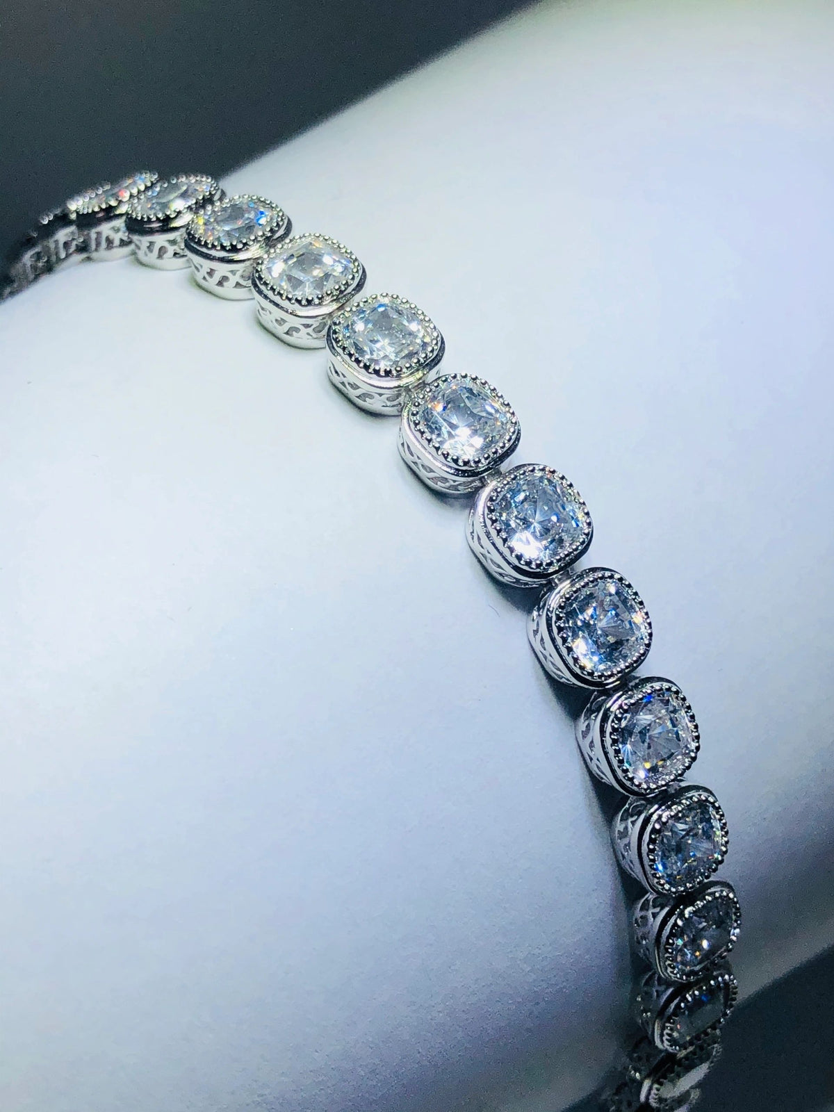 LIV platinum over sterling silver white sapphire cushion tennis bracelet