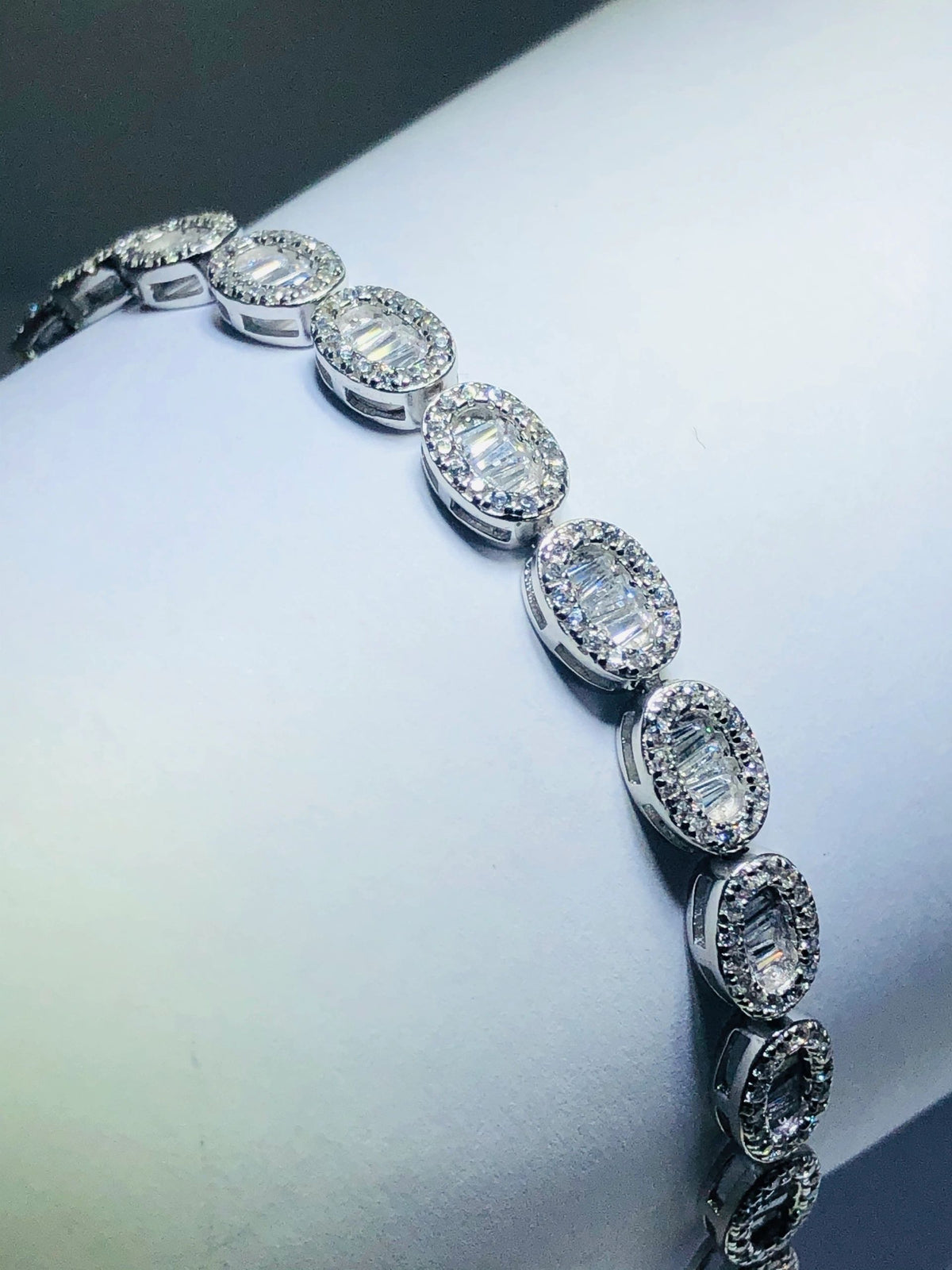 LIV platinum over sterling silver white sapphire baguette halo tennis bracelet