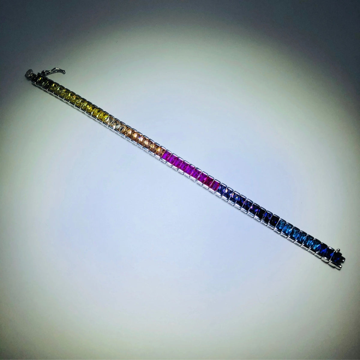 LIV platinum over sterling silver rainbow sapphire tennis bracelet 6” length