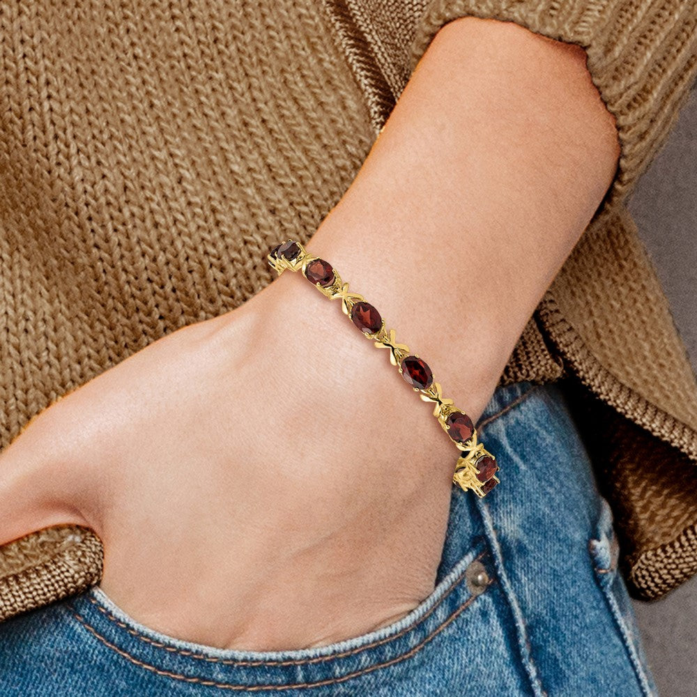 14k Complete 7x5mm Oval Garnet X-design 7 inch Bracelet