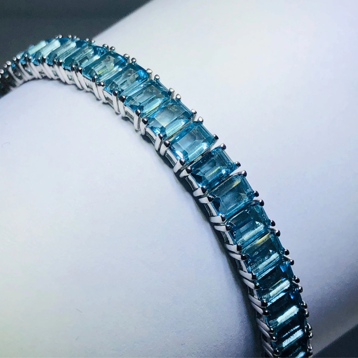 LIV platinum over sterling silver blue sapphire emerald cut bracelet bracelet