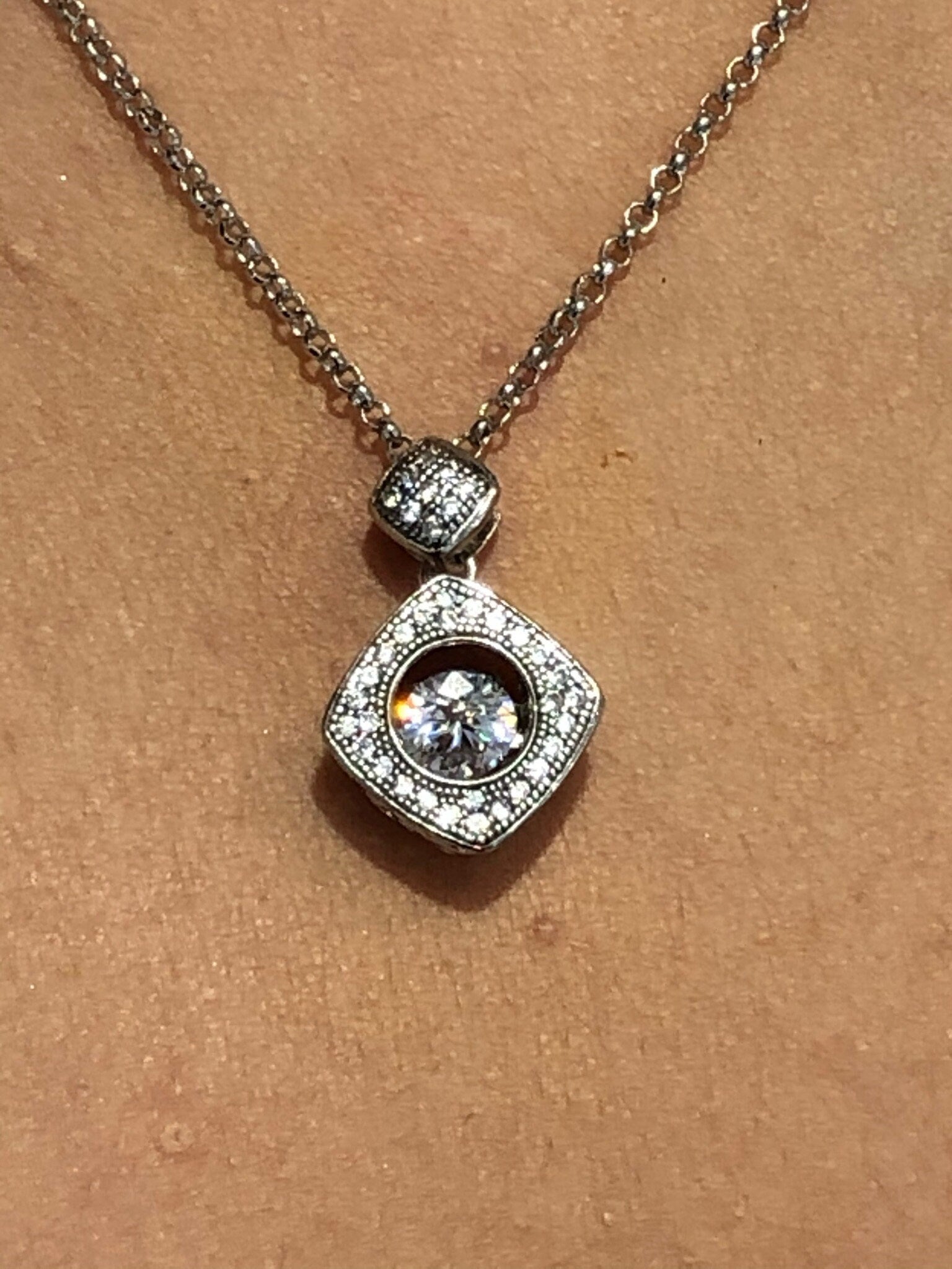 LIV Platinum over Sterling Silver Unique Halo Design Necklace With Hand Set Simulated Diamonds "Dancing Diamond" Center Stone