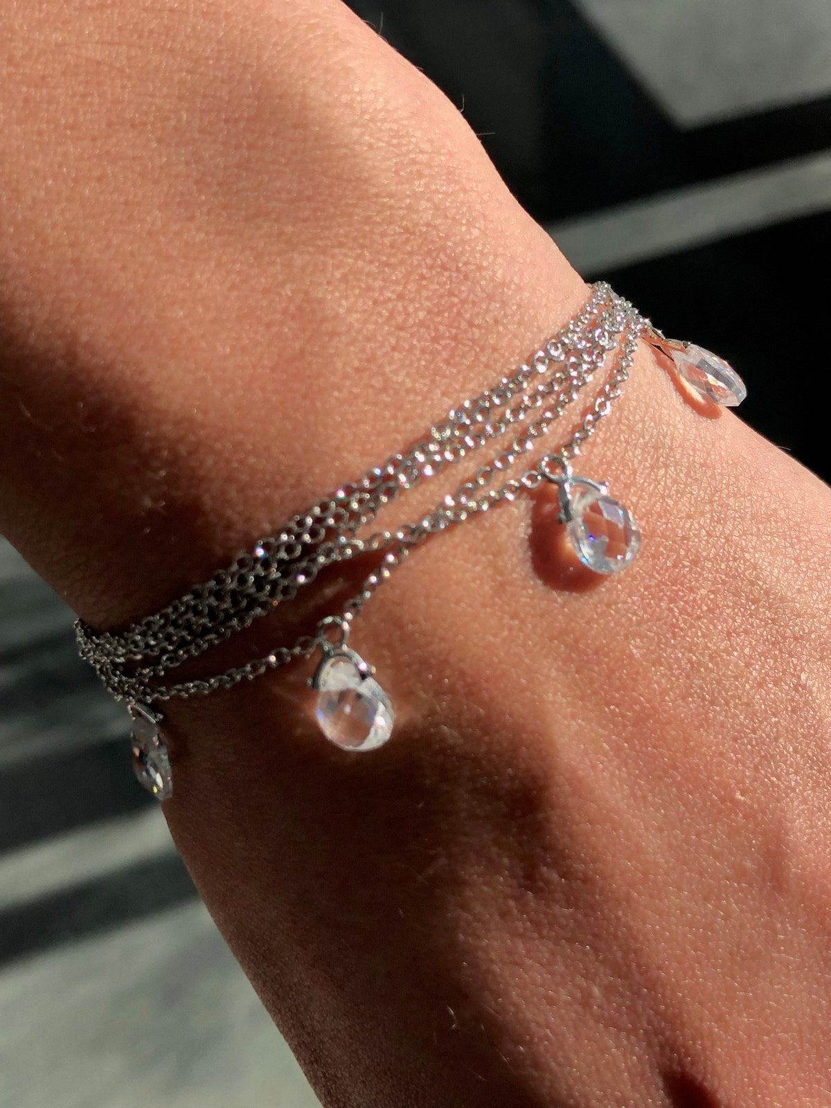 LIV Platinum Sterling Silver Pave White Sapphire Tear Drop Dangle Tennis Bracelet